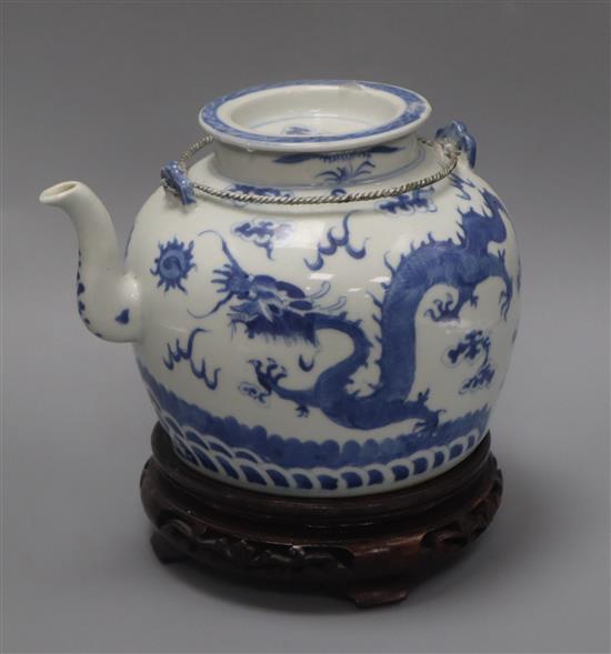 A Chinese blue and white dragon teapot, Daoguang, on carved wooden stand overall height 21cm